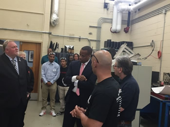 Assistant Secretary Jay Williams touring Asnuntuck Community College’s Advanced Manufacturing Center.