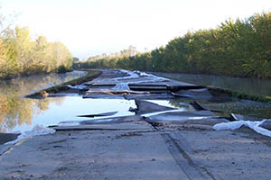 Images of the flooding and damage caused by floods on Highway 169 in Minnesota