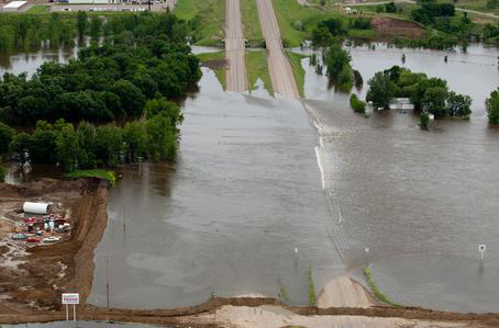 Minot, N.D., June 25, 2011 -- Aerial view of Highway 2, east of Minot closed due to flooding from the Souris River. FEMA Photo by Andrea Booher - Jun 24, 2011 - Location: Minot, ND