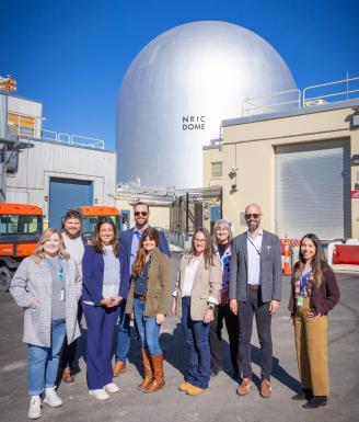 Photo of Eric Smith visiting with representatives from the Intermountain-West Nuclear Energy Corridor.