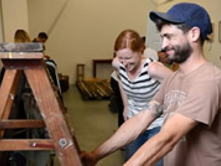 Makers Jeremiah Jones of Sewlab USA and Rachel Bone from Red Prairie Press set up for the Pop-Up Shop.