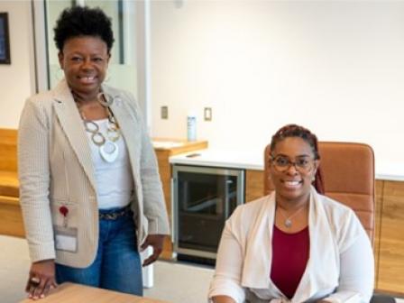 Debra Davis (left), pictured here with an EDCKC RLF borrower, participated in the Equitable Lending Leaders program.